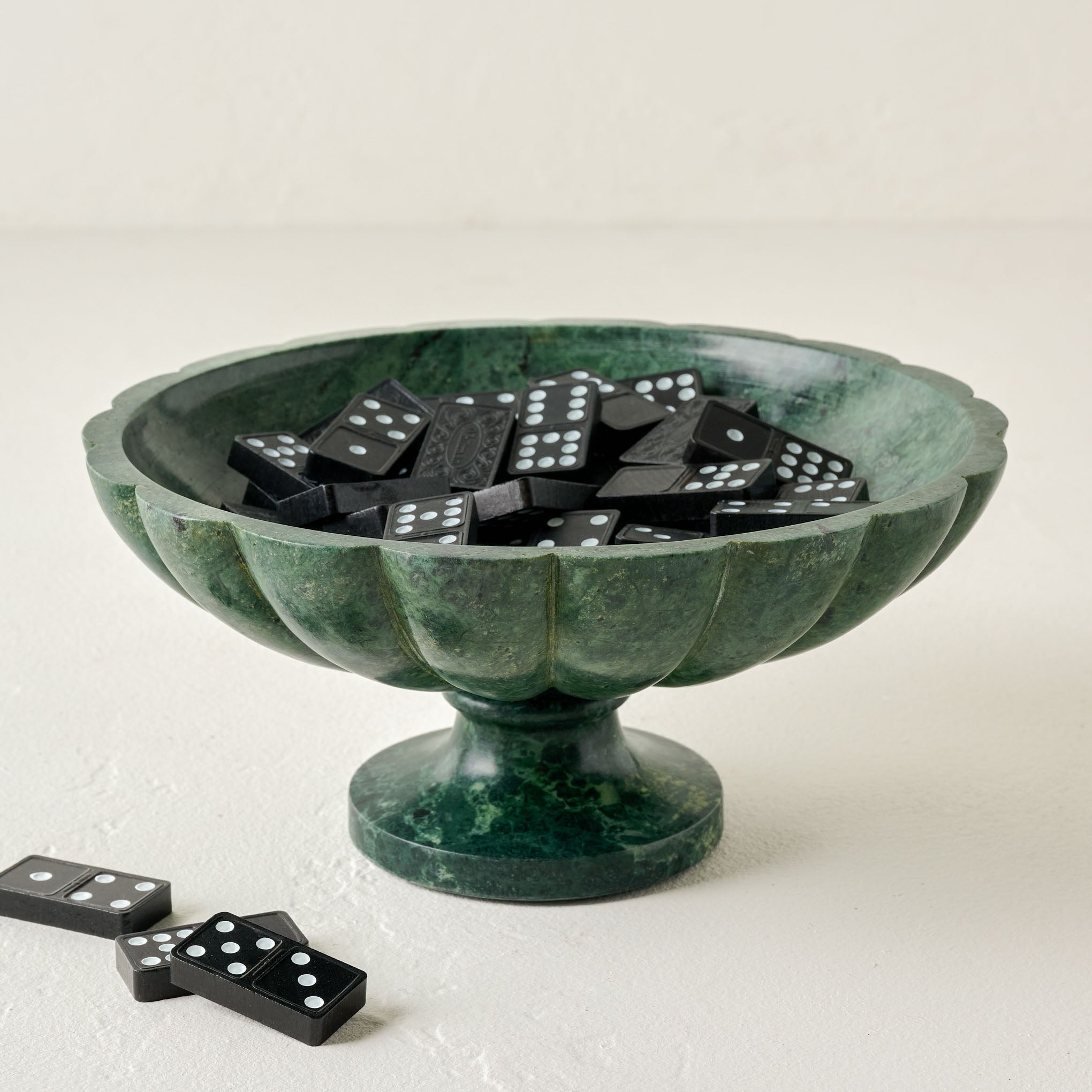 Green Marble Scalloped Bowl shown filled with dominoes