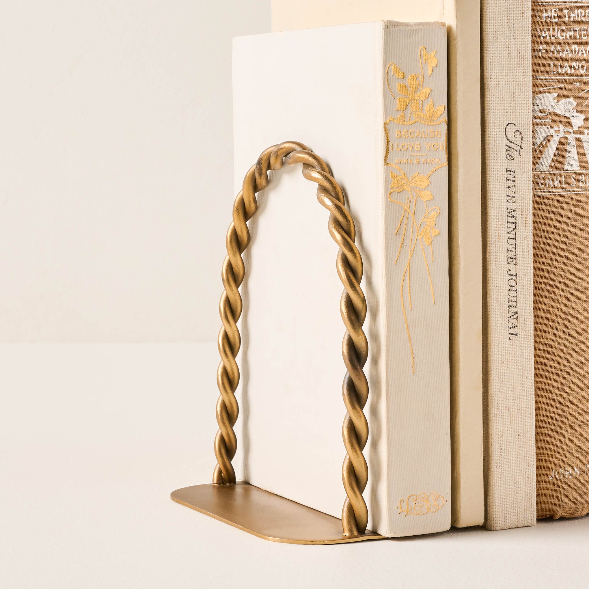 Twisted Vintage Inspired Bookends next to books