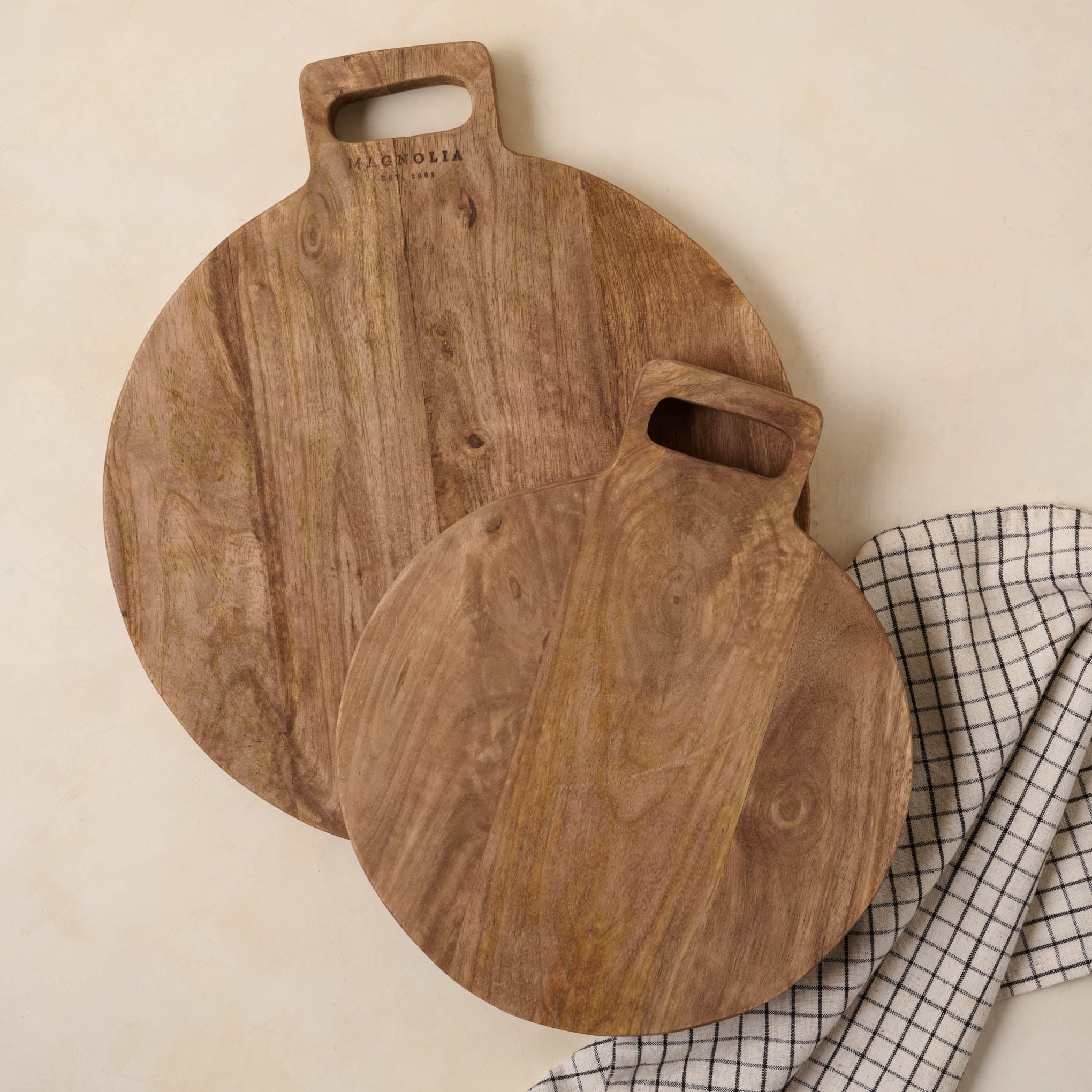 Mango Wood Round Bread Board in two sizes Items range from $34.00 to $56.00