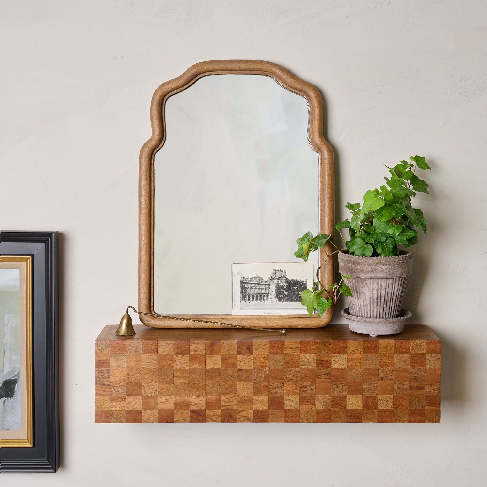 Olivia Wood Framed Accent Mirror on a wall shelf