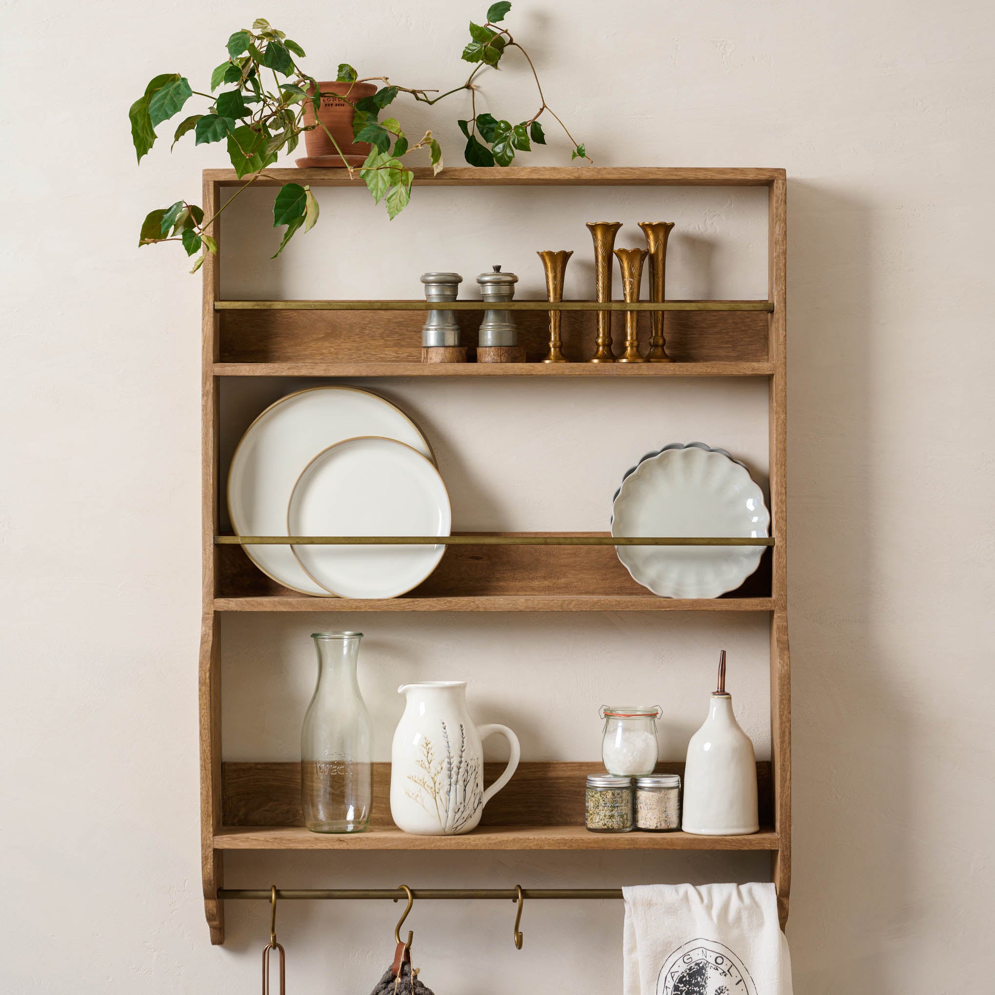 Hannon Wood and Brass Display Shelf with spring kitchen items on shelves $244.00