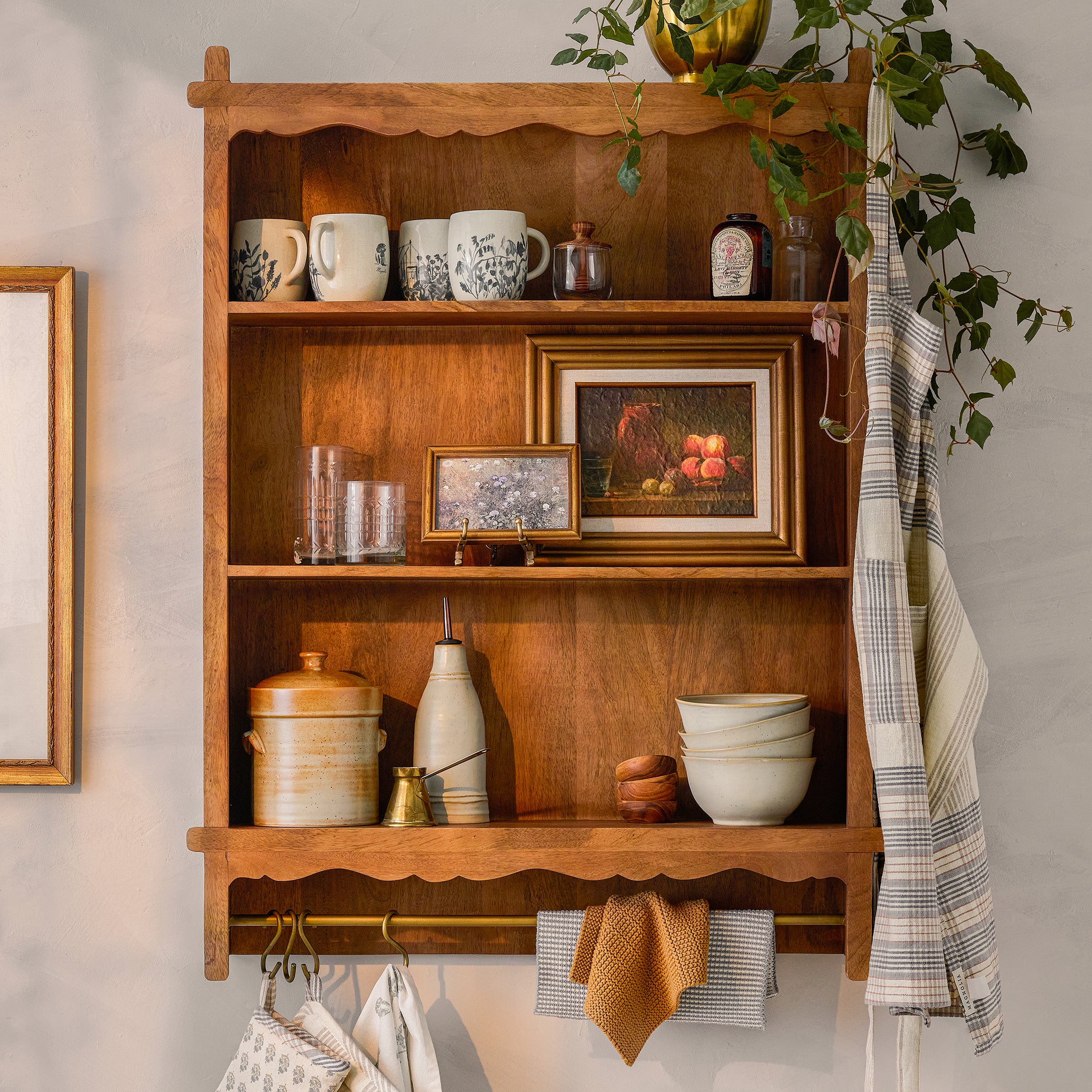 Daphne Wooden Wall Shelf with items on shelf $248.00