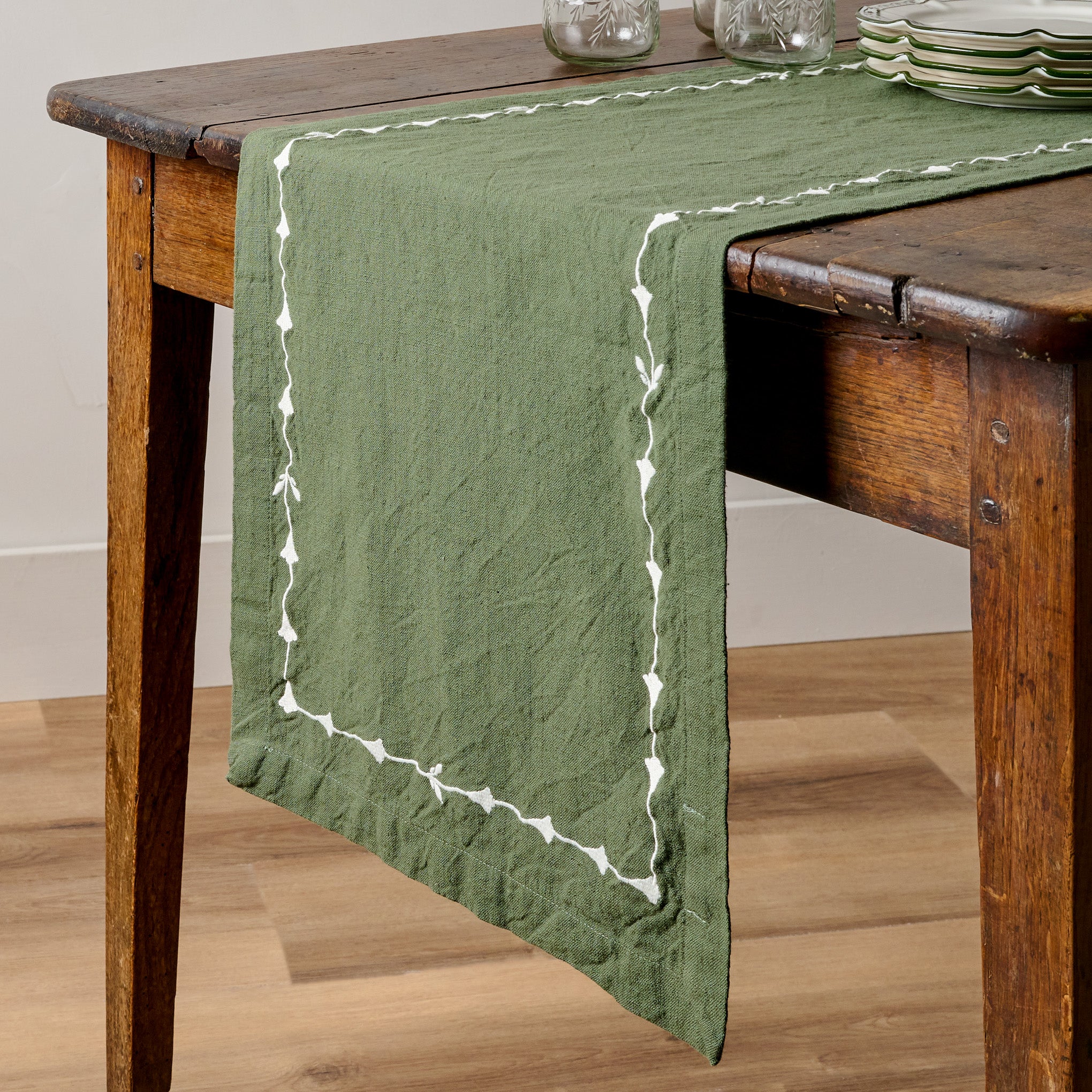 Tulip Embroidered Edge Table Runner shown on table