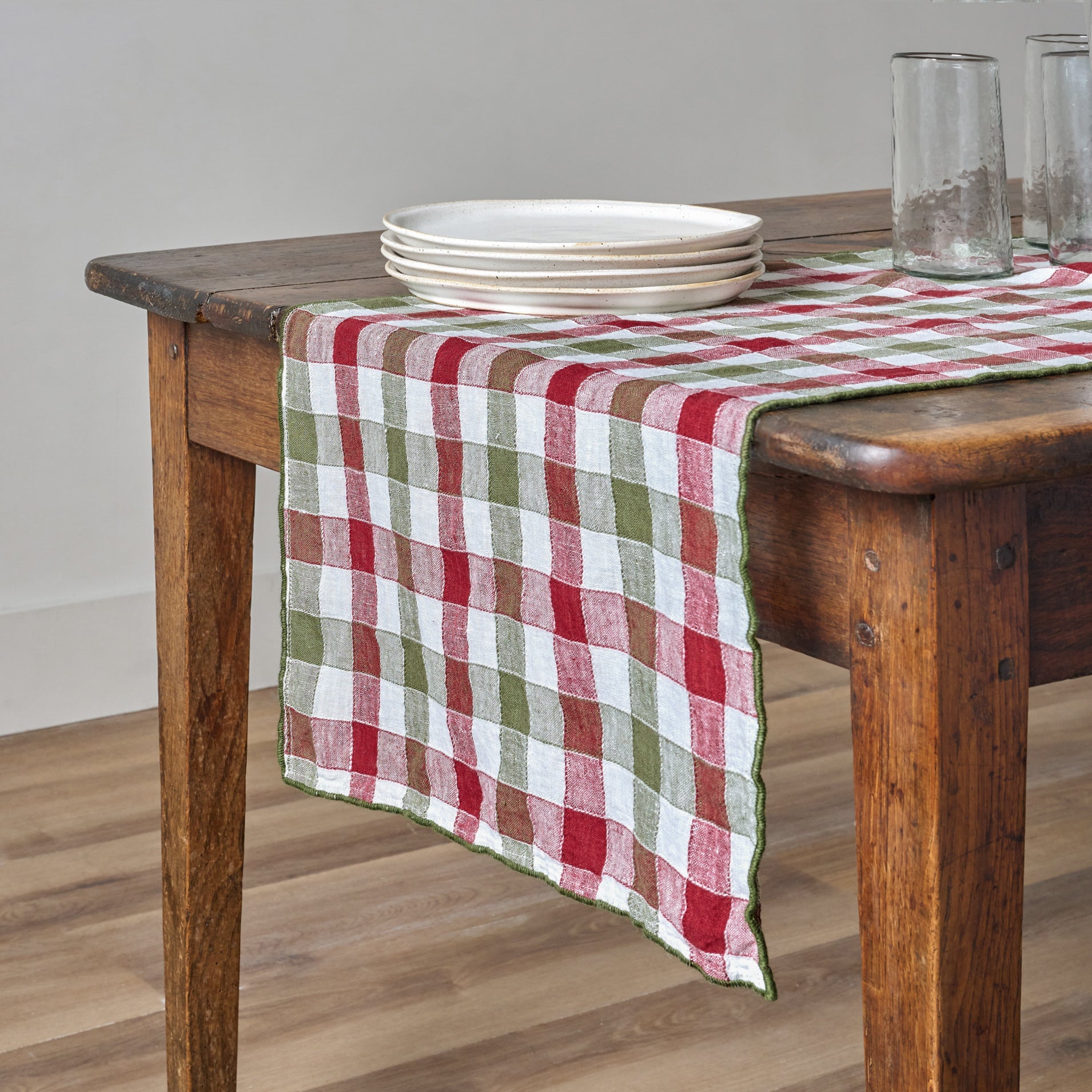 Holiday Gingham Table Runner shown on a table