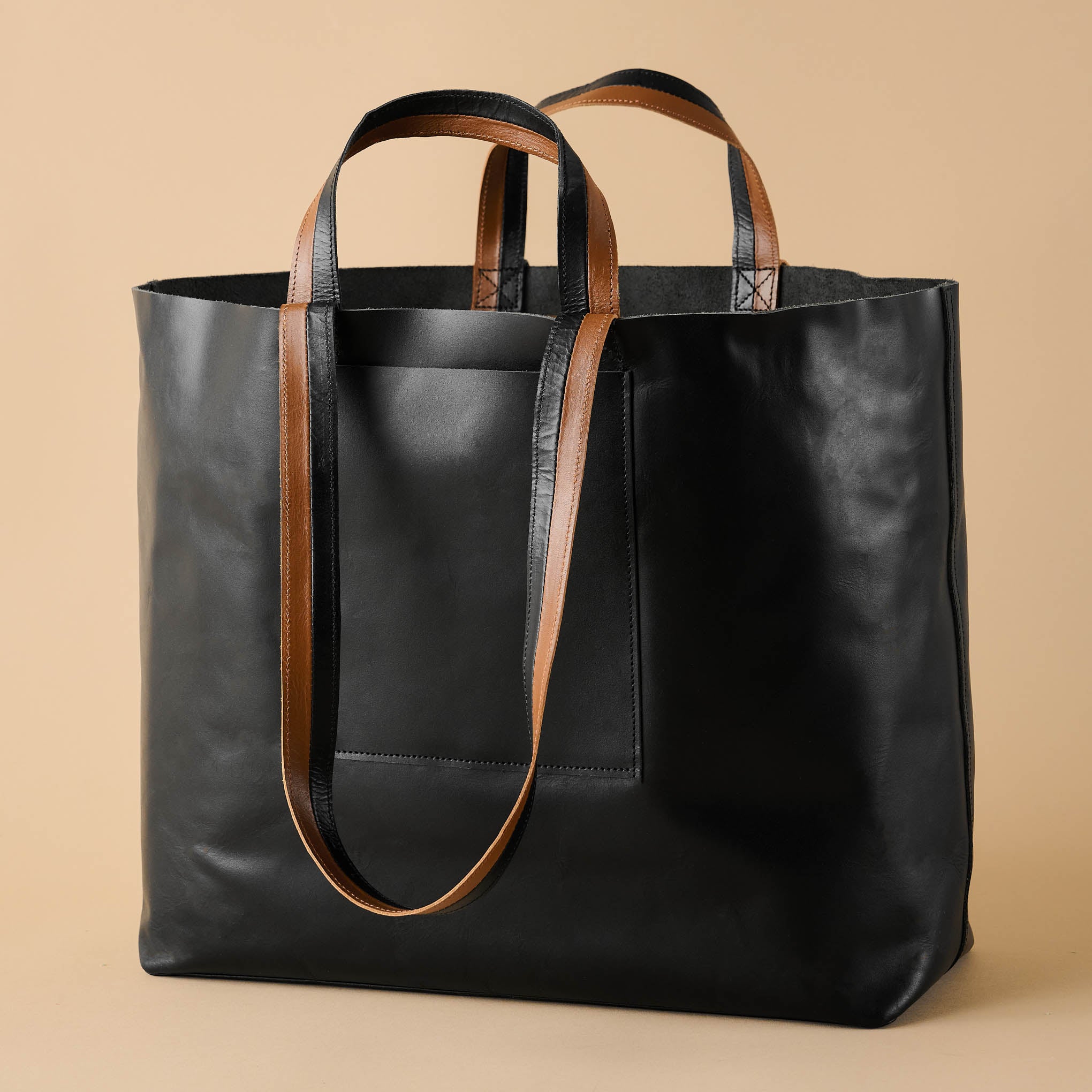 Men's Accessories With Dark Brown Leather Bags On Wooden Table