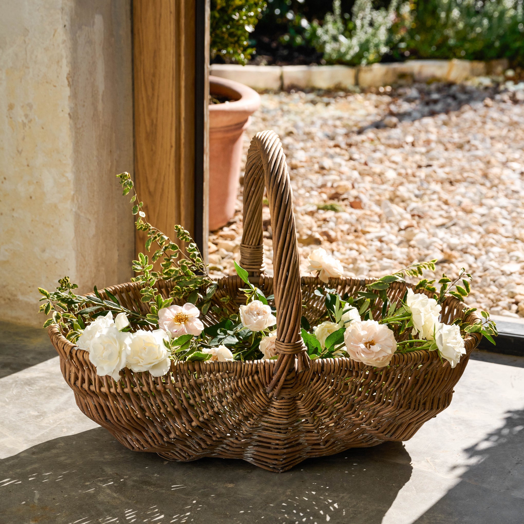 Garden Gathering Basket with flowers inside $128.00