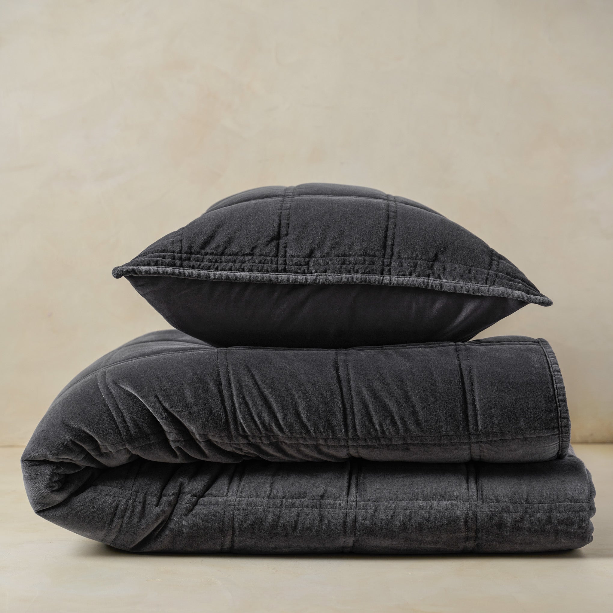 Weekend Velvet Quilt - Slate folded with sham on top On sale with items ranging from $125.00 to $150.00, discounted from $250.00 to $300.00