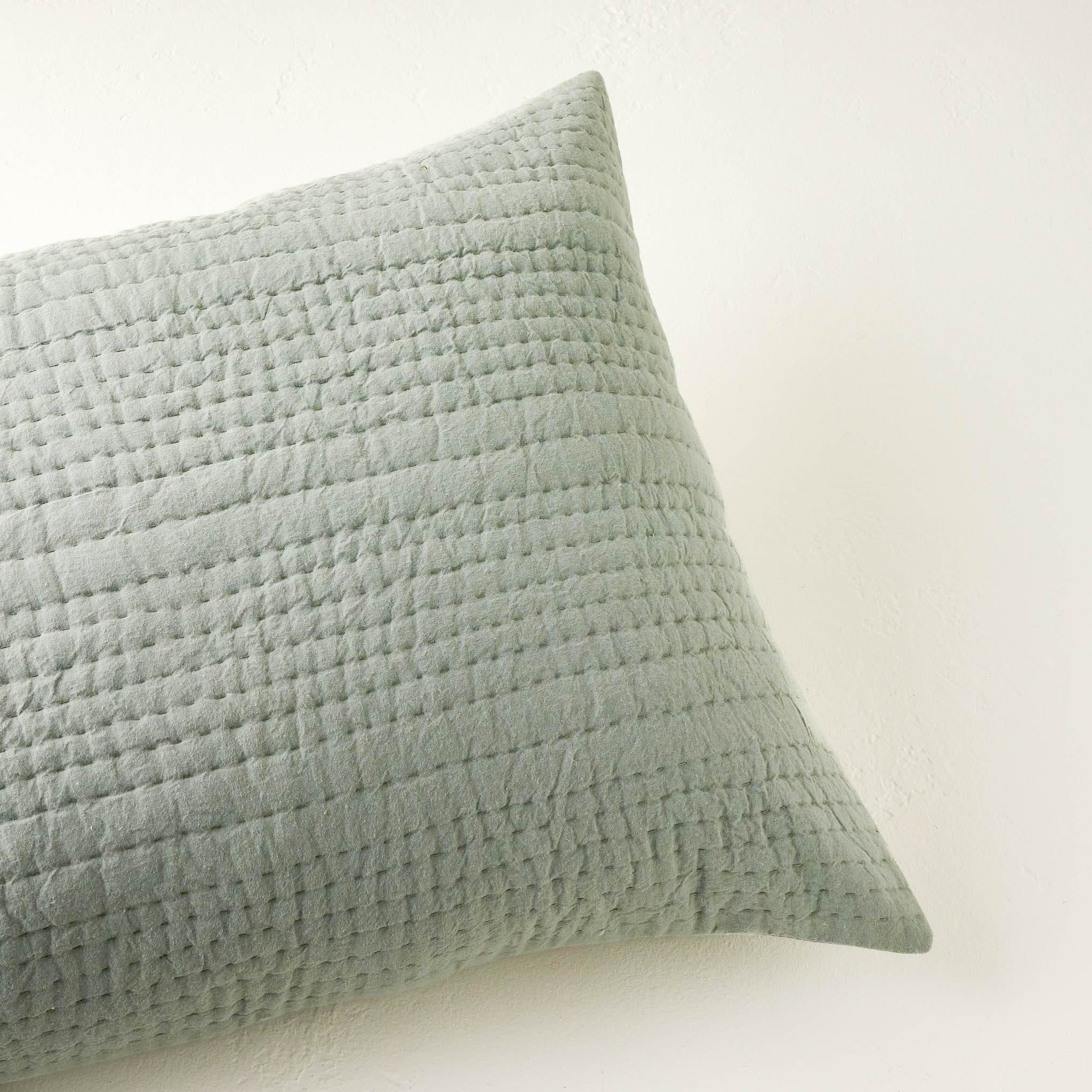 top view of Stonewashed Seagrass Green Pebbled Pillow Sham Items range from $49.00 to $59.00