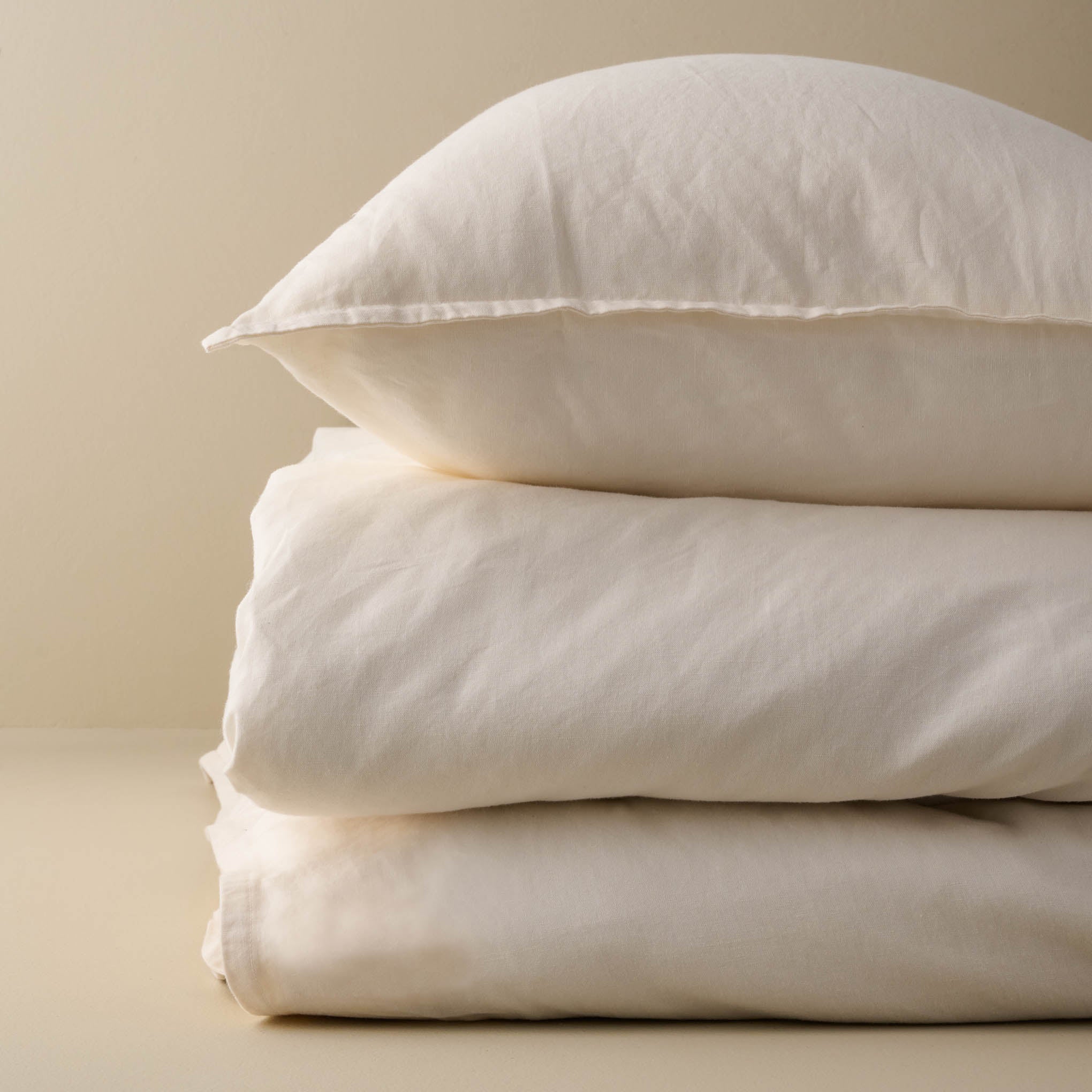 Stacked Antique White Washed Linen Cotton Duvet Cover and Pillow Sham Items range from $159.00 to $169.00