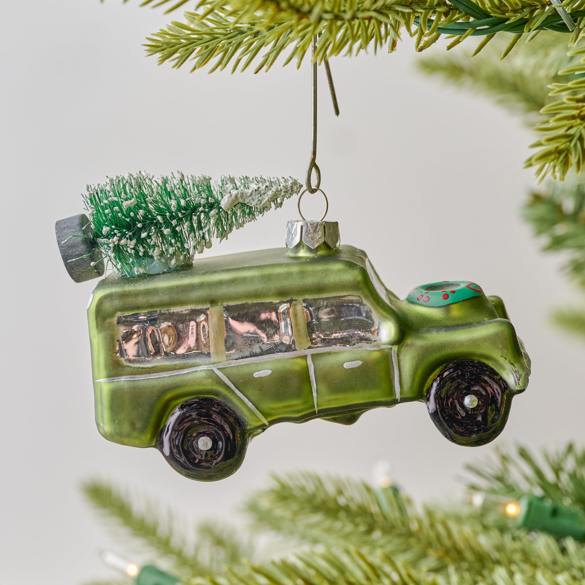 Magnolia Truck Ornament shown on tree