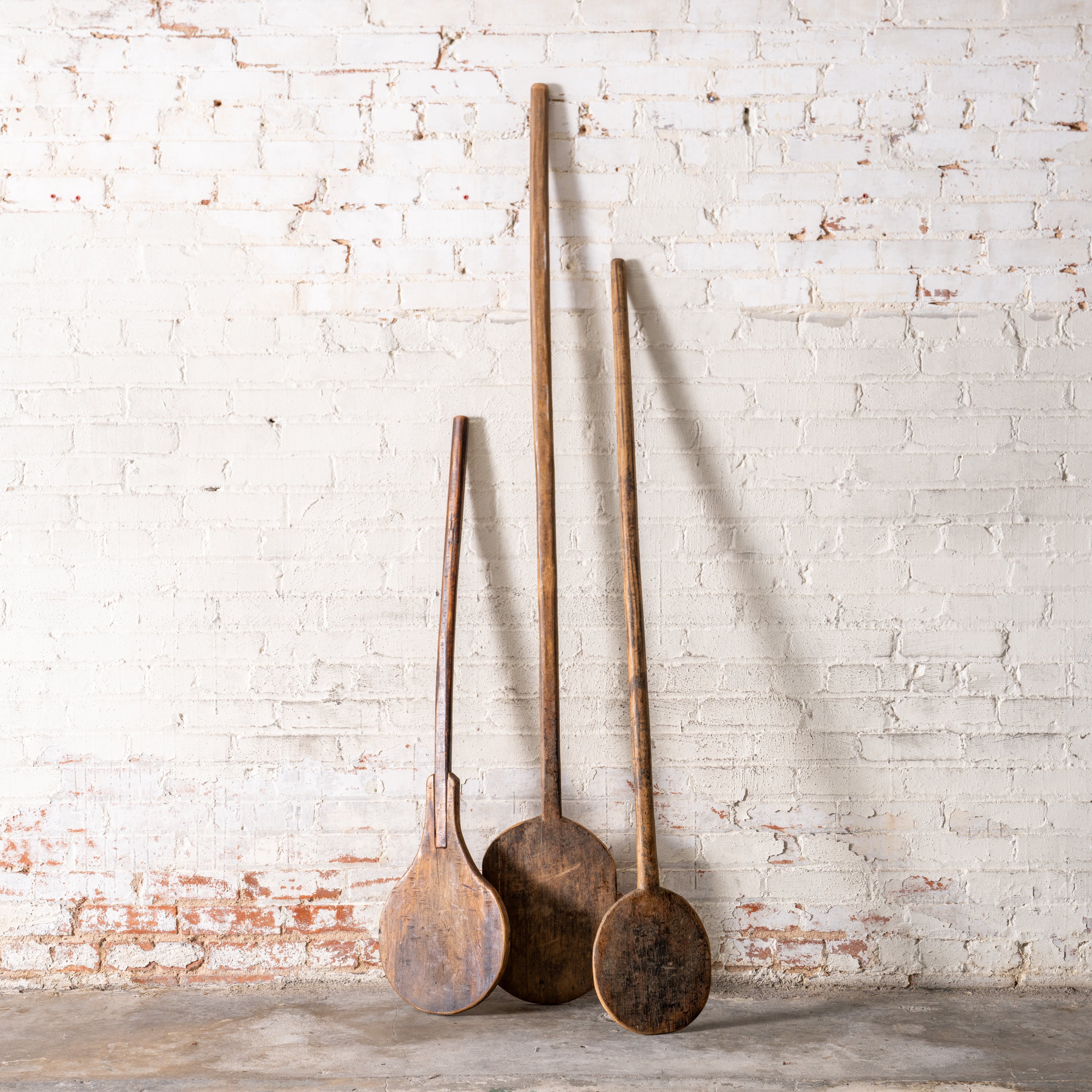 Vintage European Bakery Paddles up against wall