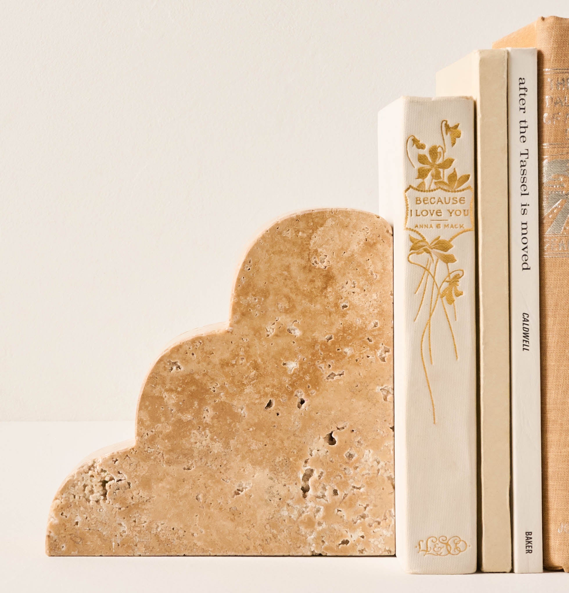 Scalloped Pompei Bookends next to some books On sale for $51.80, discounted from $74.00