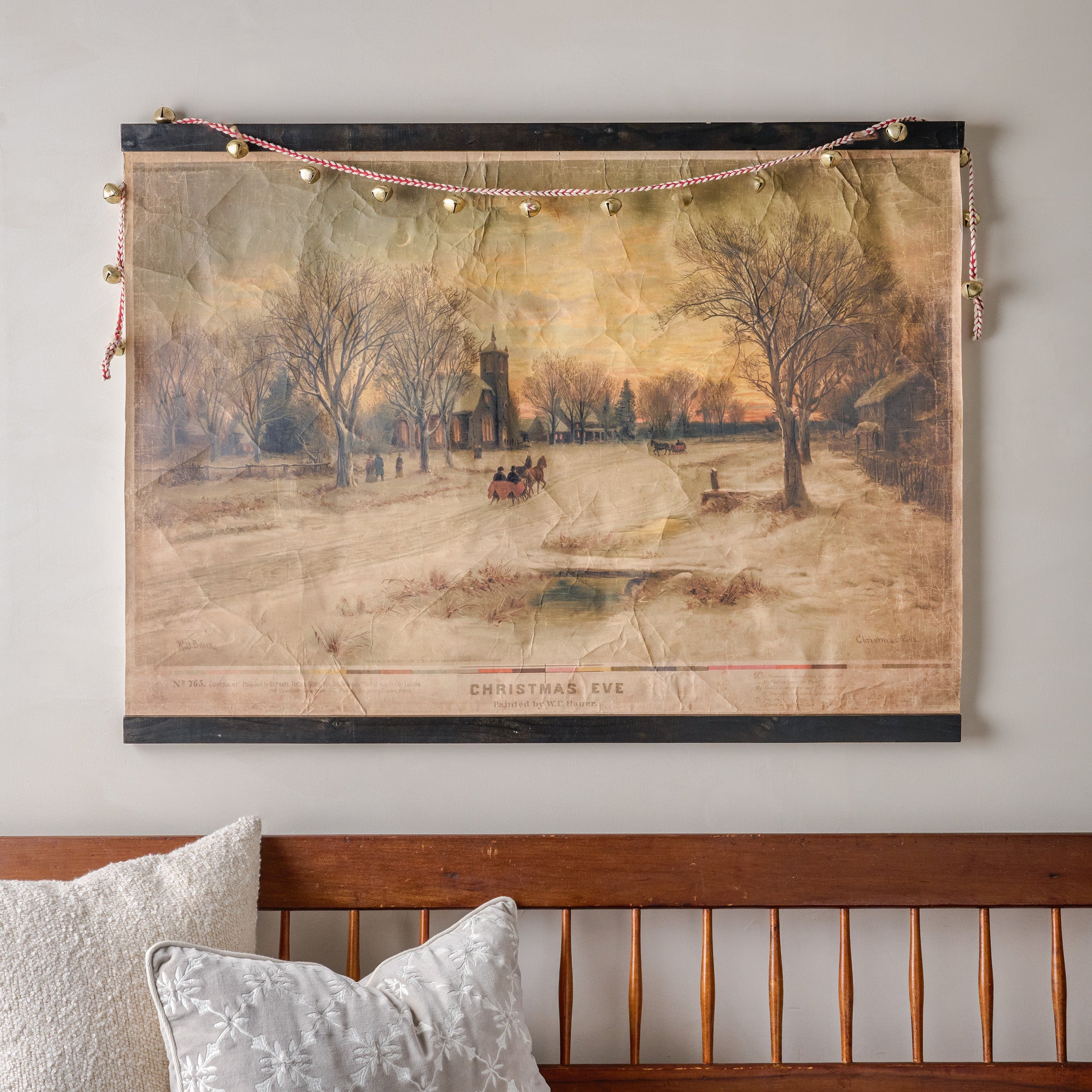 Vintage Christmas Eve Tapestry shown with bell garland and bench