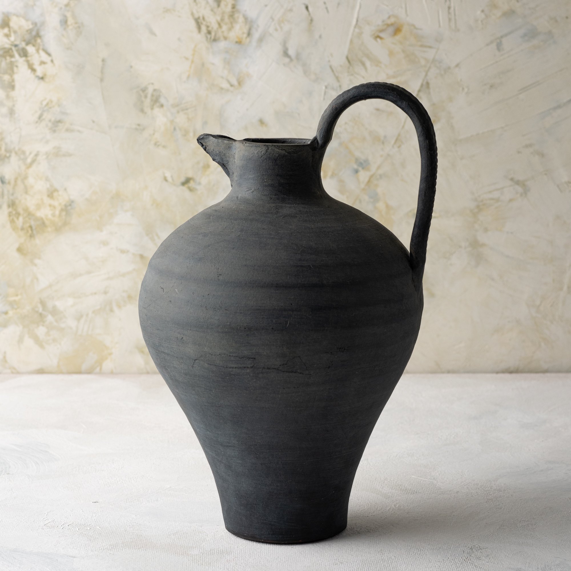 magnolia ravine black ceramic jug vase with handle$64.00