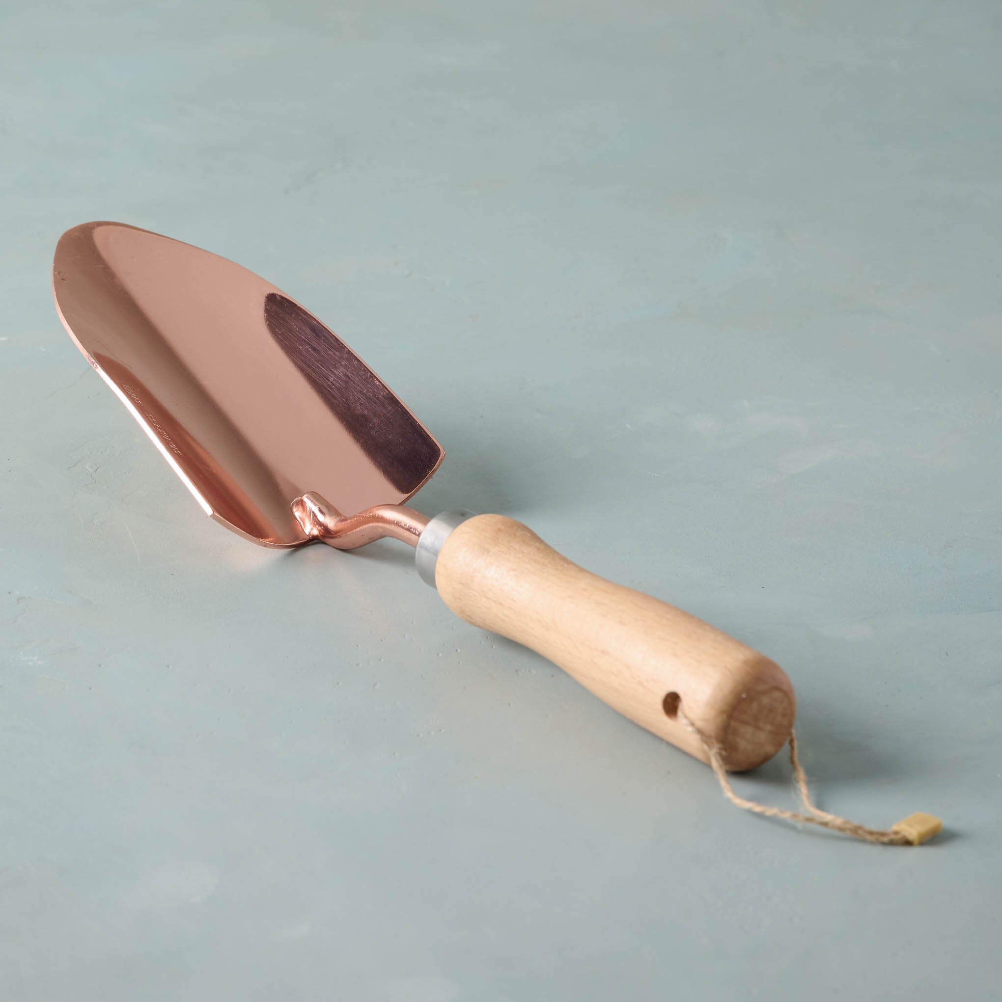 Copper spade with wooden handle. On sale for $9.60, discounted from $16.00