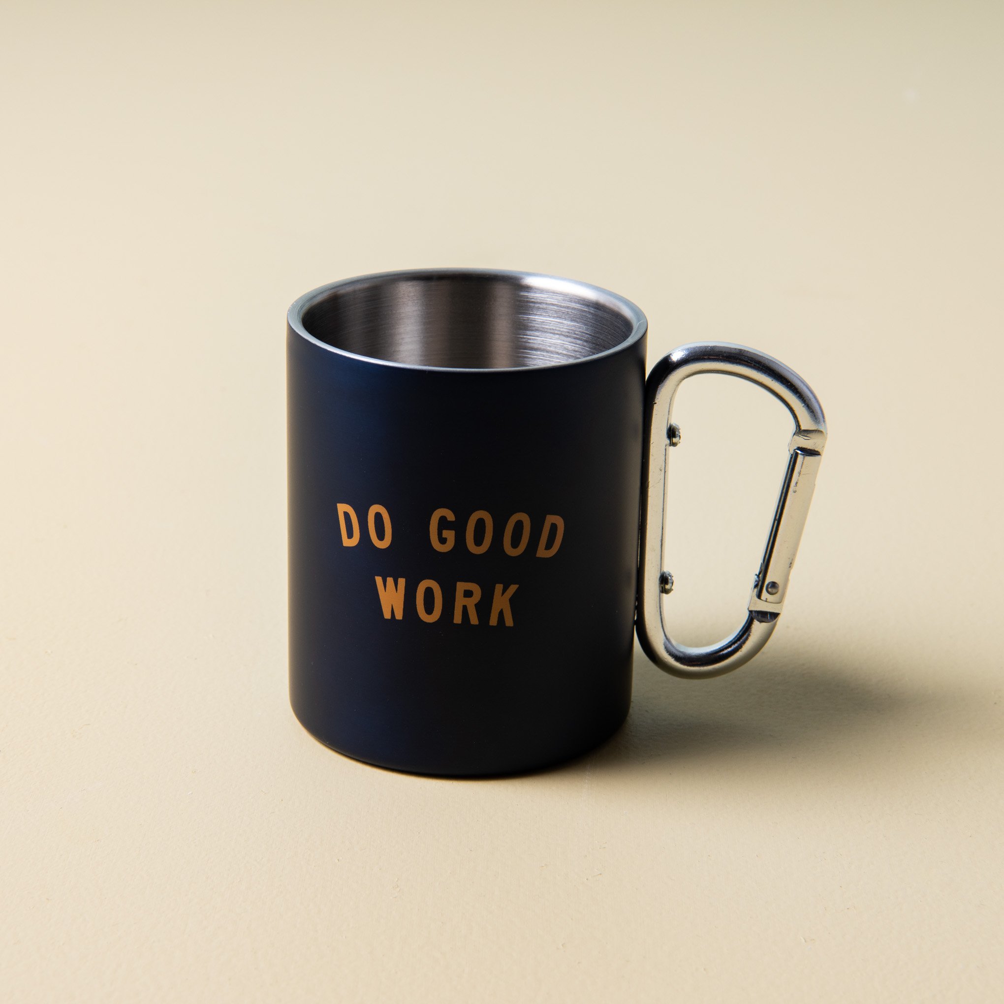 navy stainless steel mug with "do good work" printed in gold with silver carabiner handle