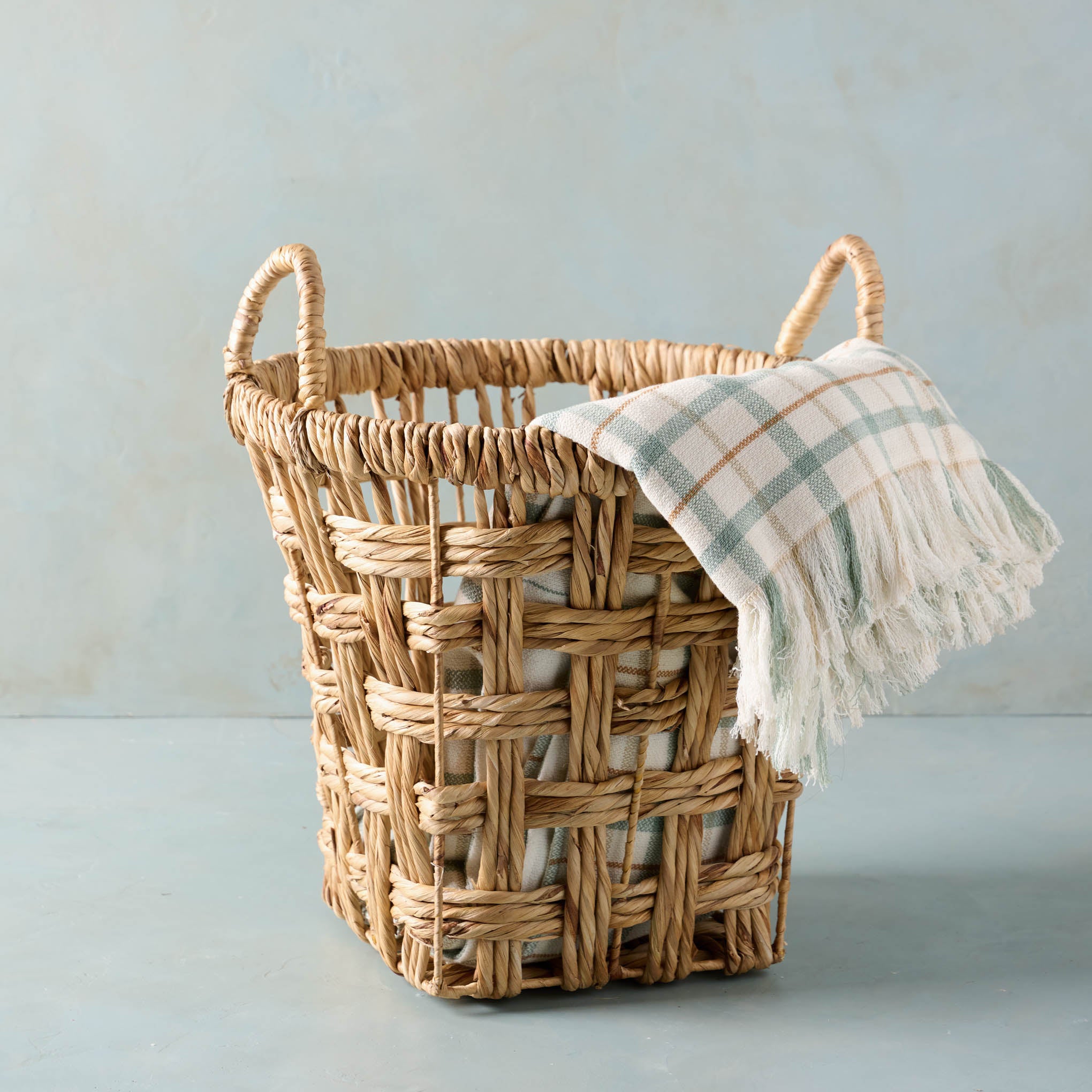 Morgan Water Hyacinth Basket with plaid throw blanket inside