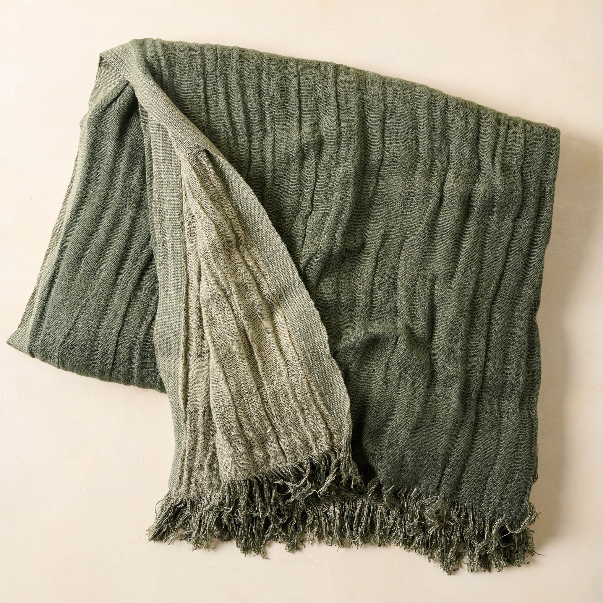 Dusty Green Cloud Cotton Oversized Throw folded  On sale for $73.50, discounted from $98.00