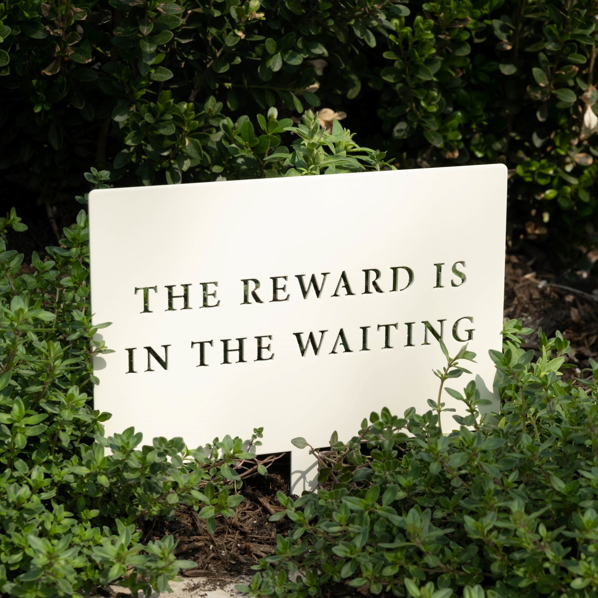 Metal Garden Stake reads the reward is in the waiting On sale for $20.40, discounted from $34.00