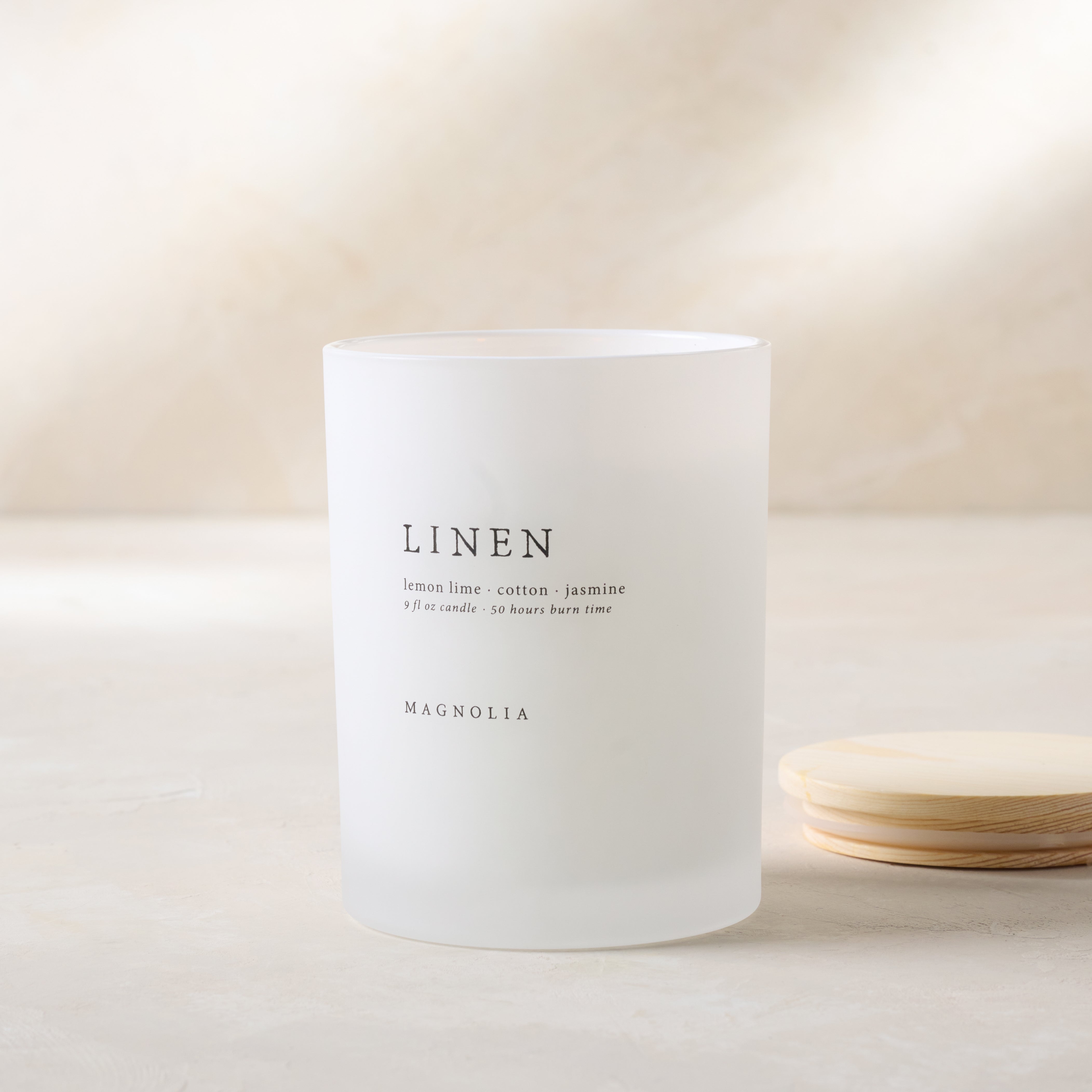 magnolia linen candle with wood lid notes scents of lemon lime cotton and jasmine Items range from $30.00 to $58.00