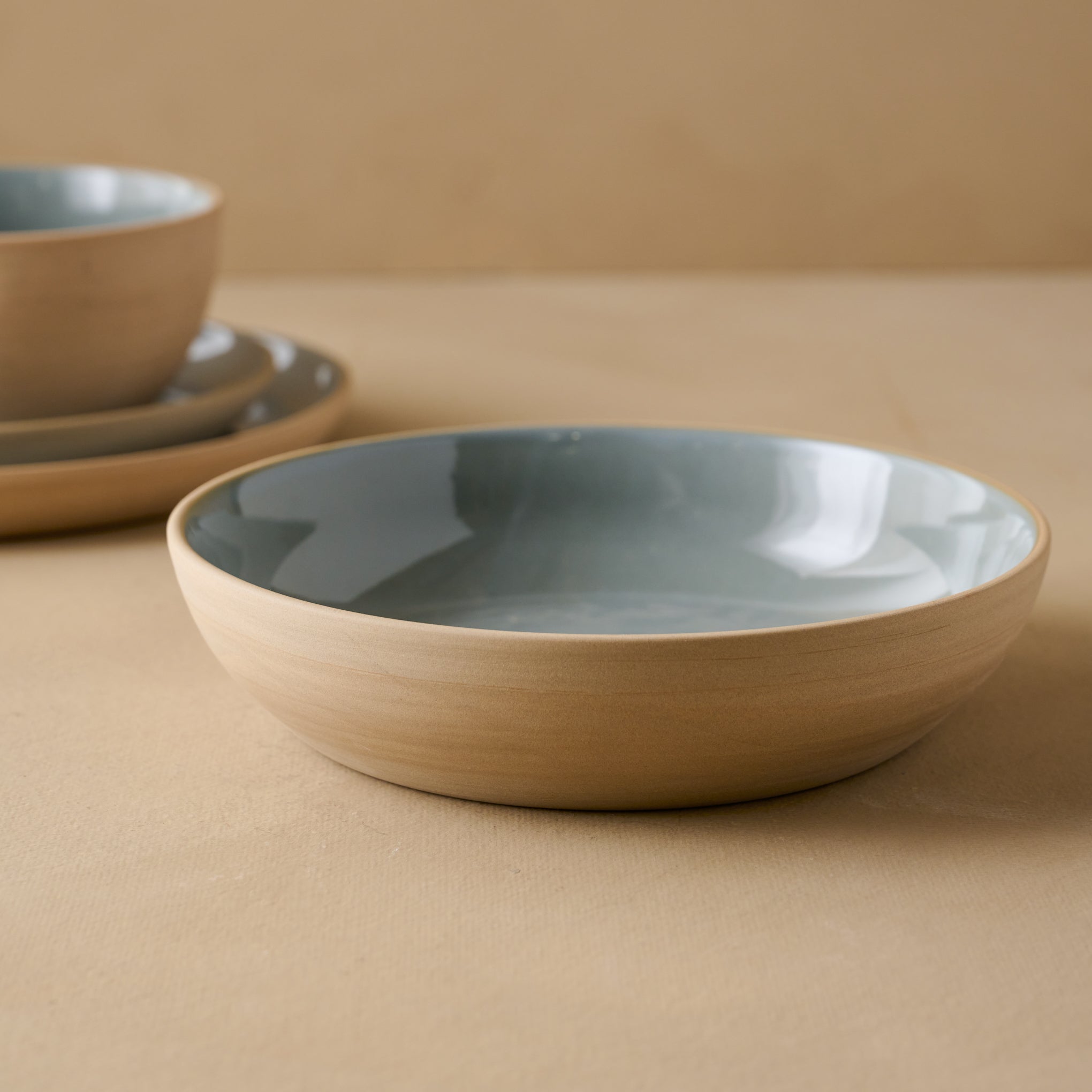 Lakelynn pasta Bowl with blue glazed interior and tan exterior