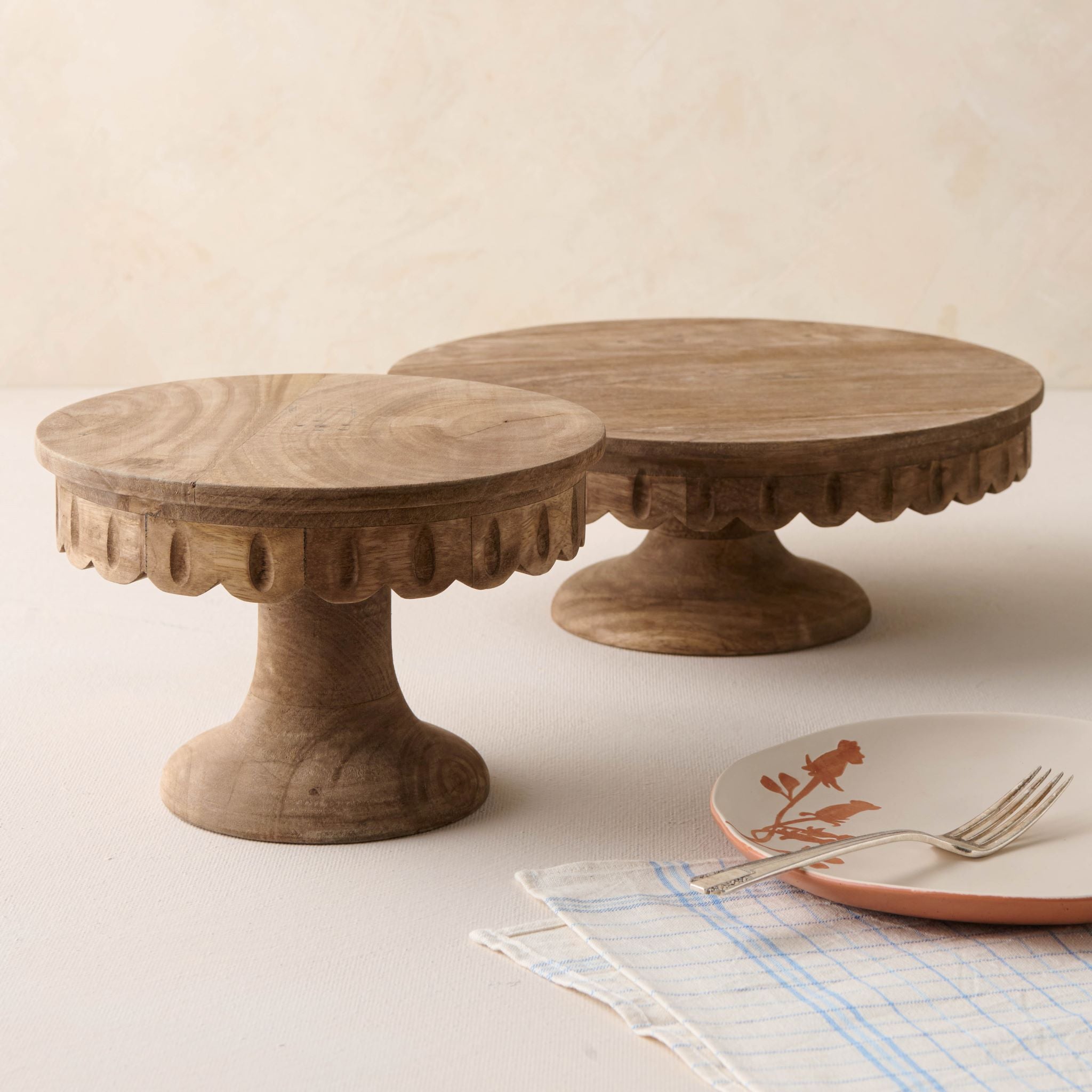 magnolia antiqued wood scalloped cake stand Items range from $46.00 to $60.00