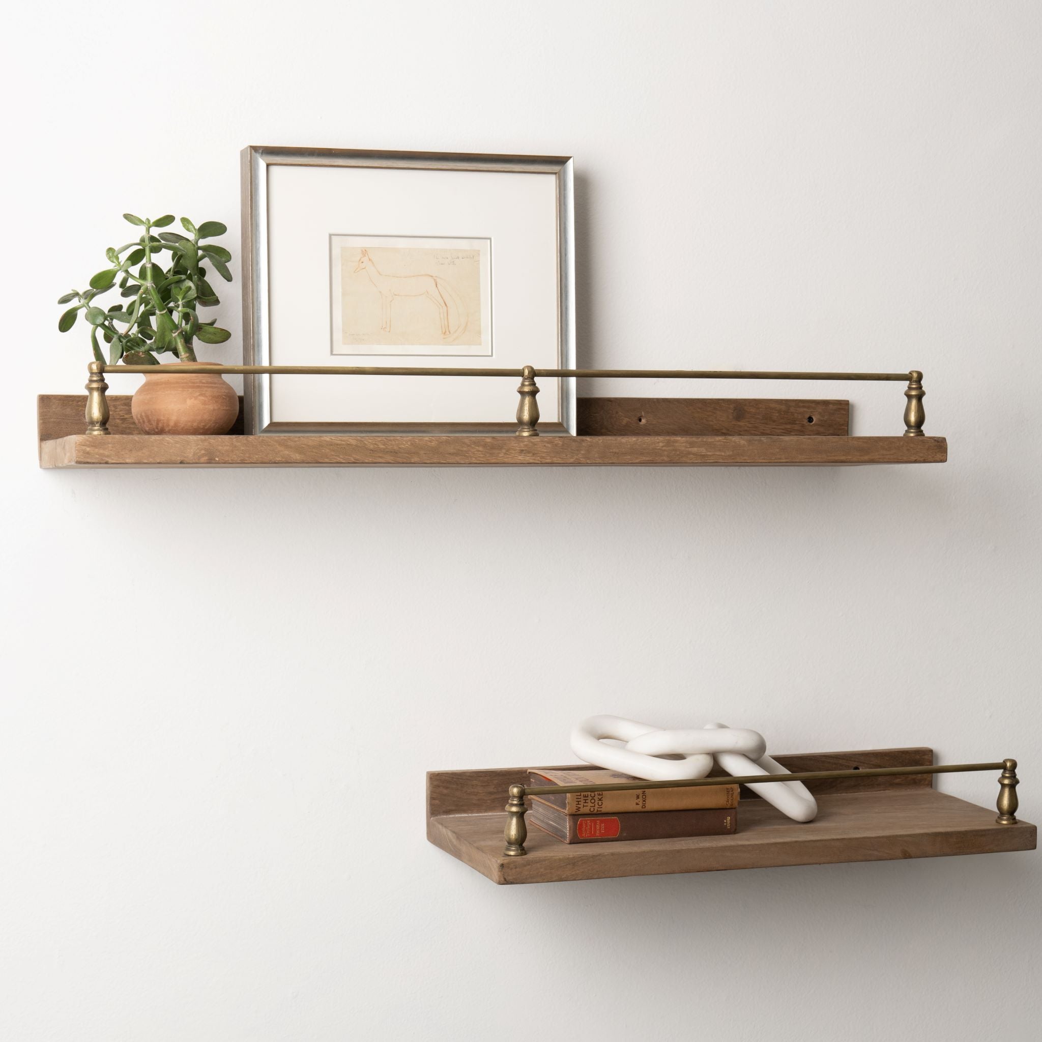 Magnolia Senna Wood and Brass Wall Shelf With Decor Items range from $90.00 to $120.00