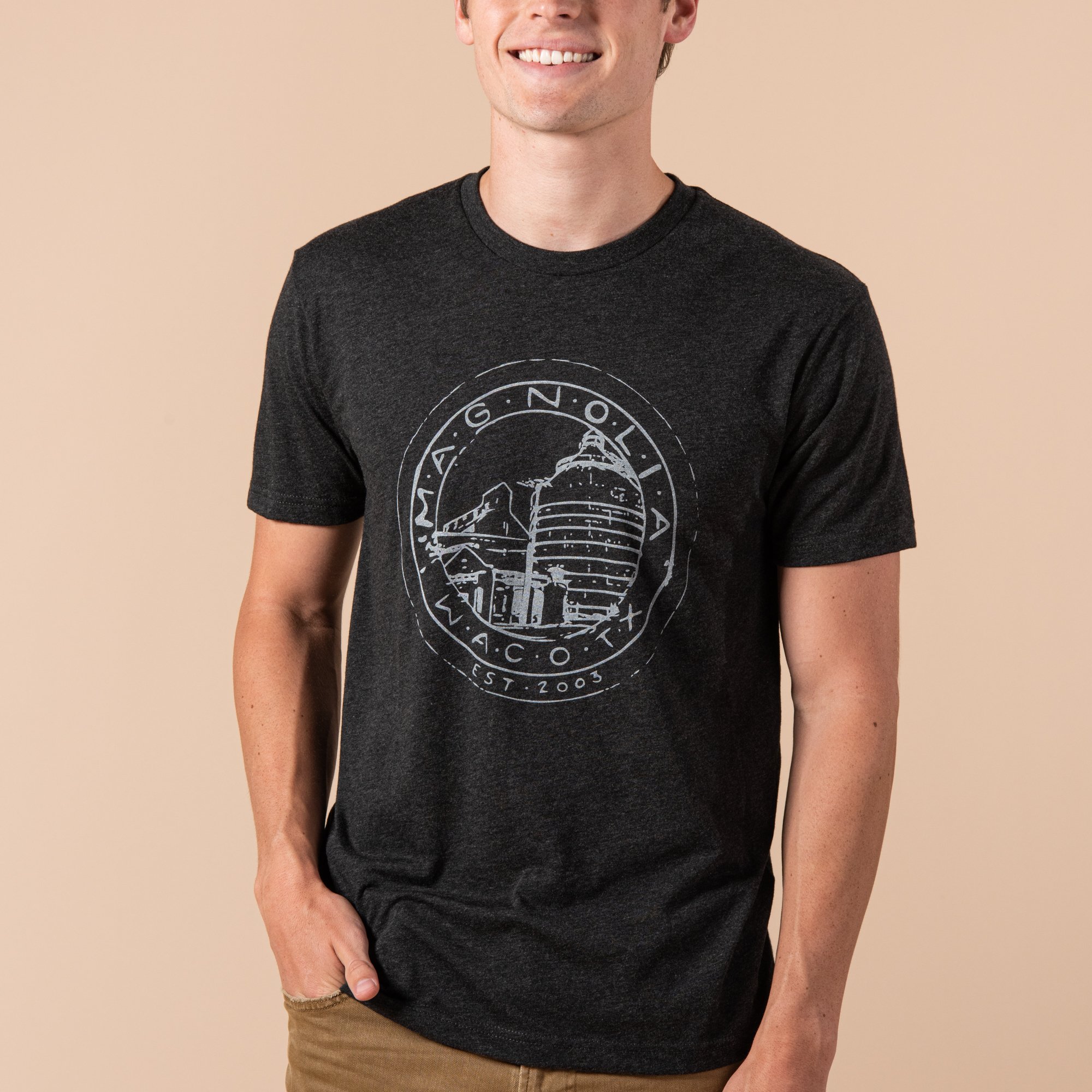 black heathered t-shirt with white magnolia silos seal logo