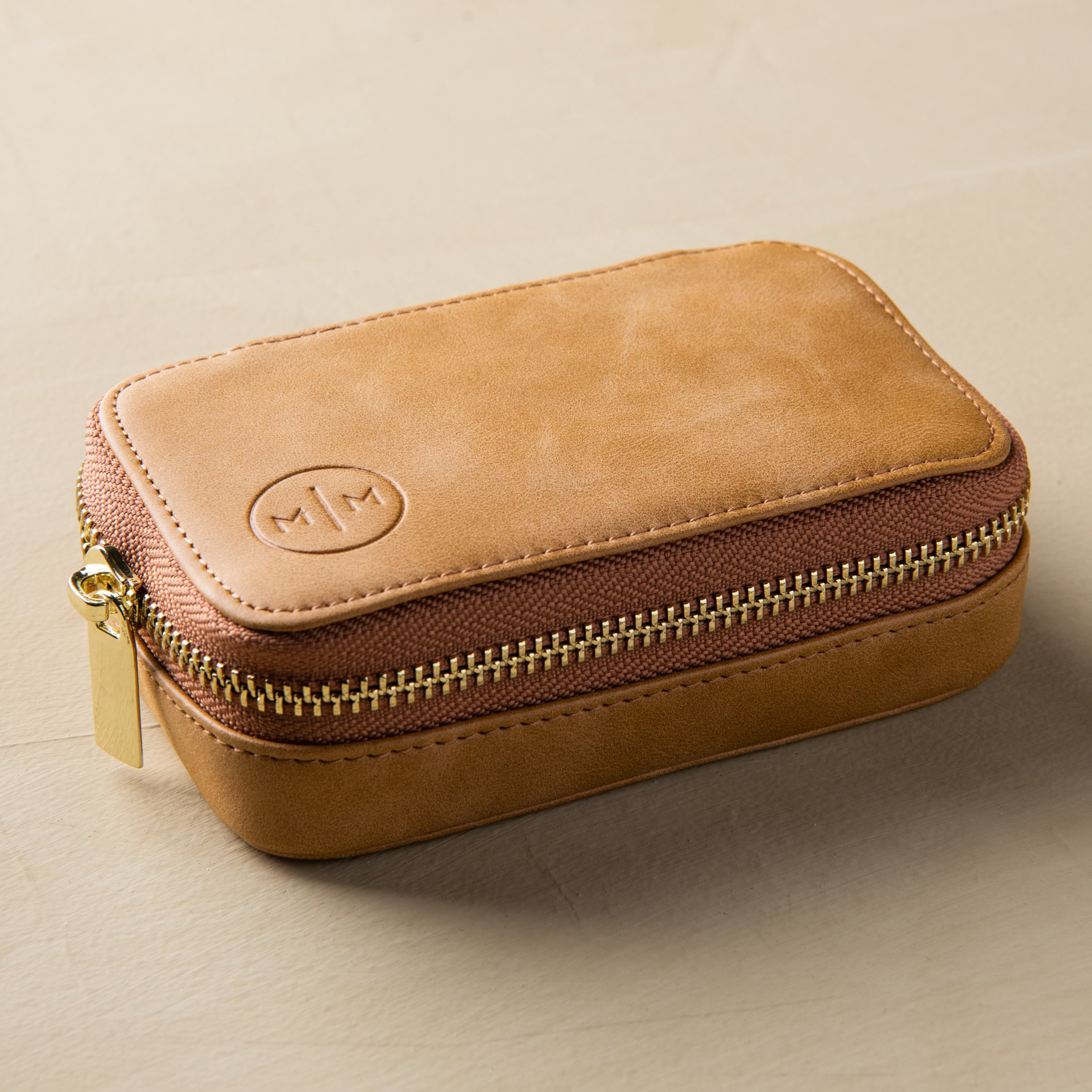 light brown leather zip-up portable jewelry case