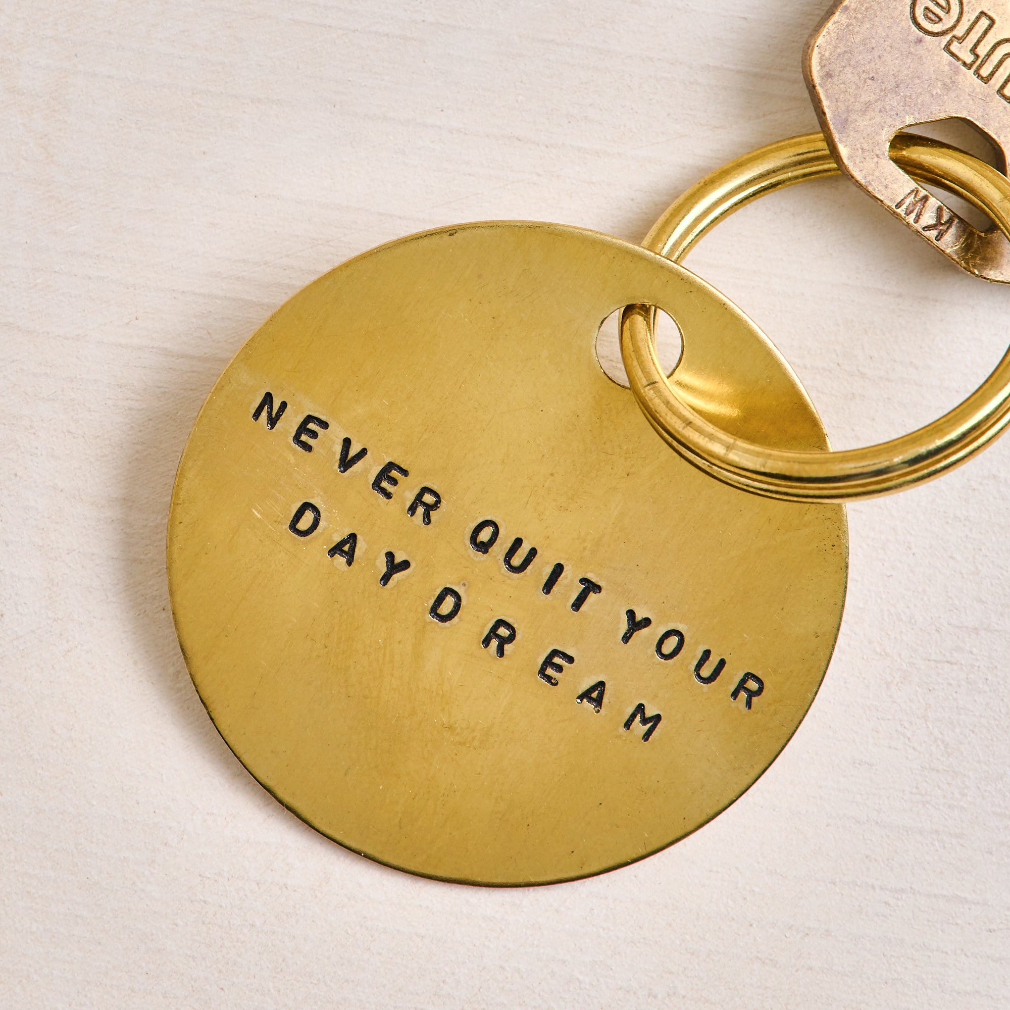 Never Quit Your Daydream Brass Keychain