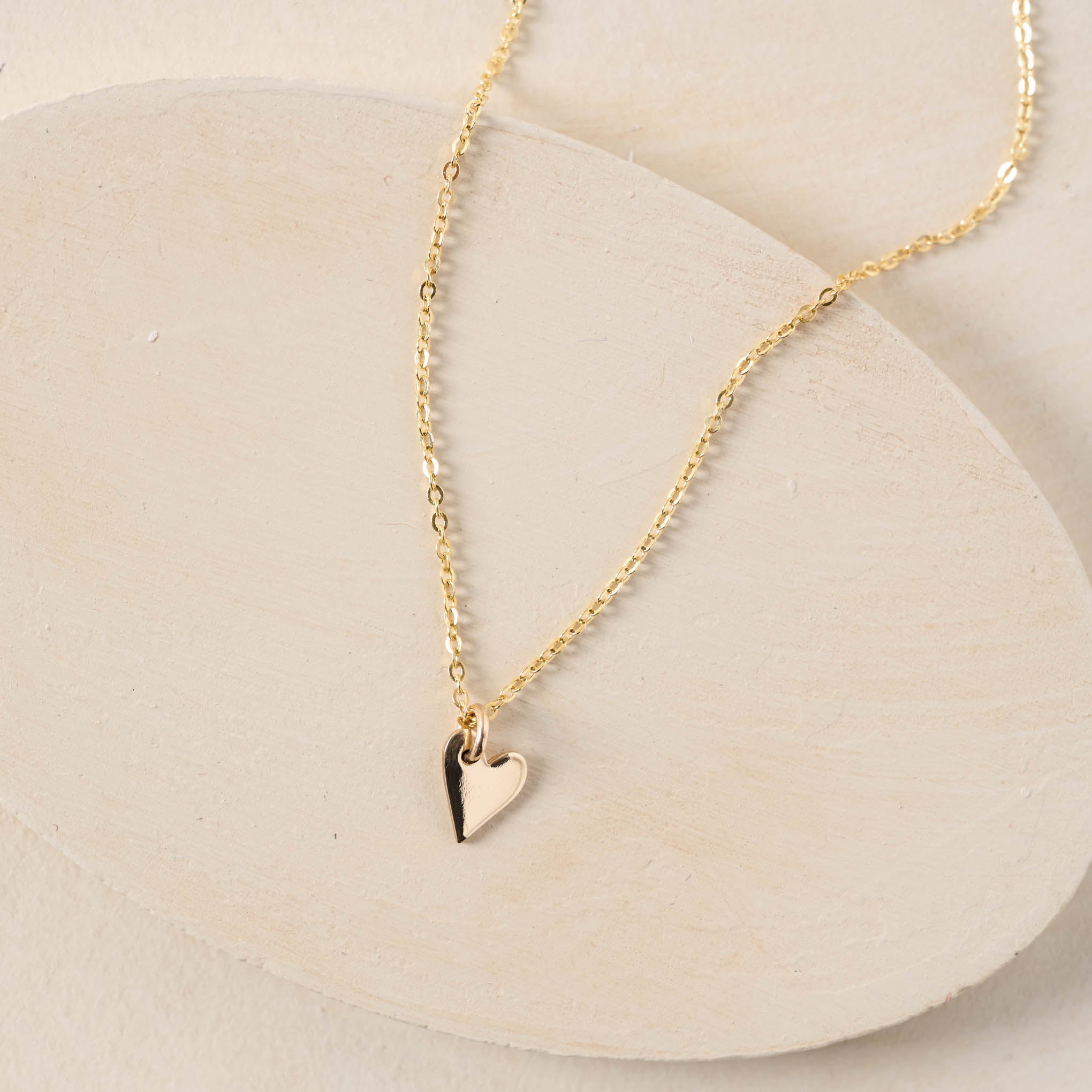 Gold small heart charm on gold chain 