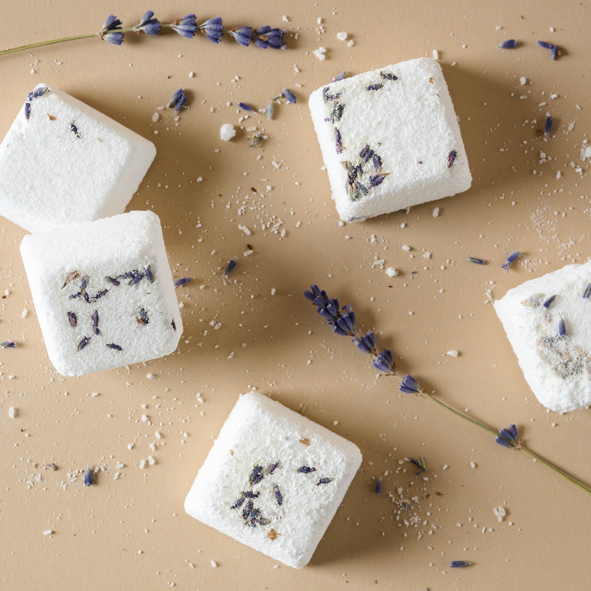 Image of five shower steamer blocks with lavender petals mixed in $18.00