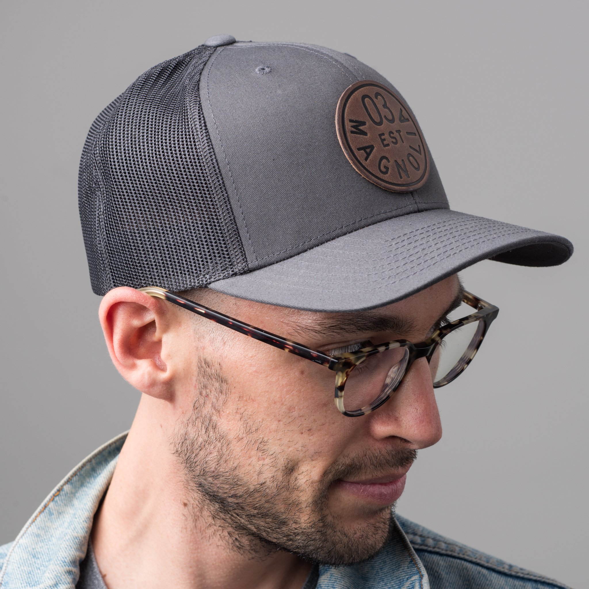 gray magnolia trucker patch with leather logo patch