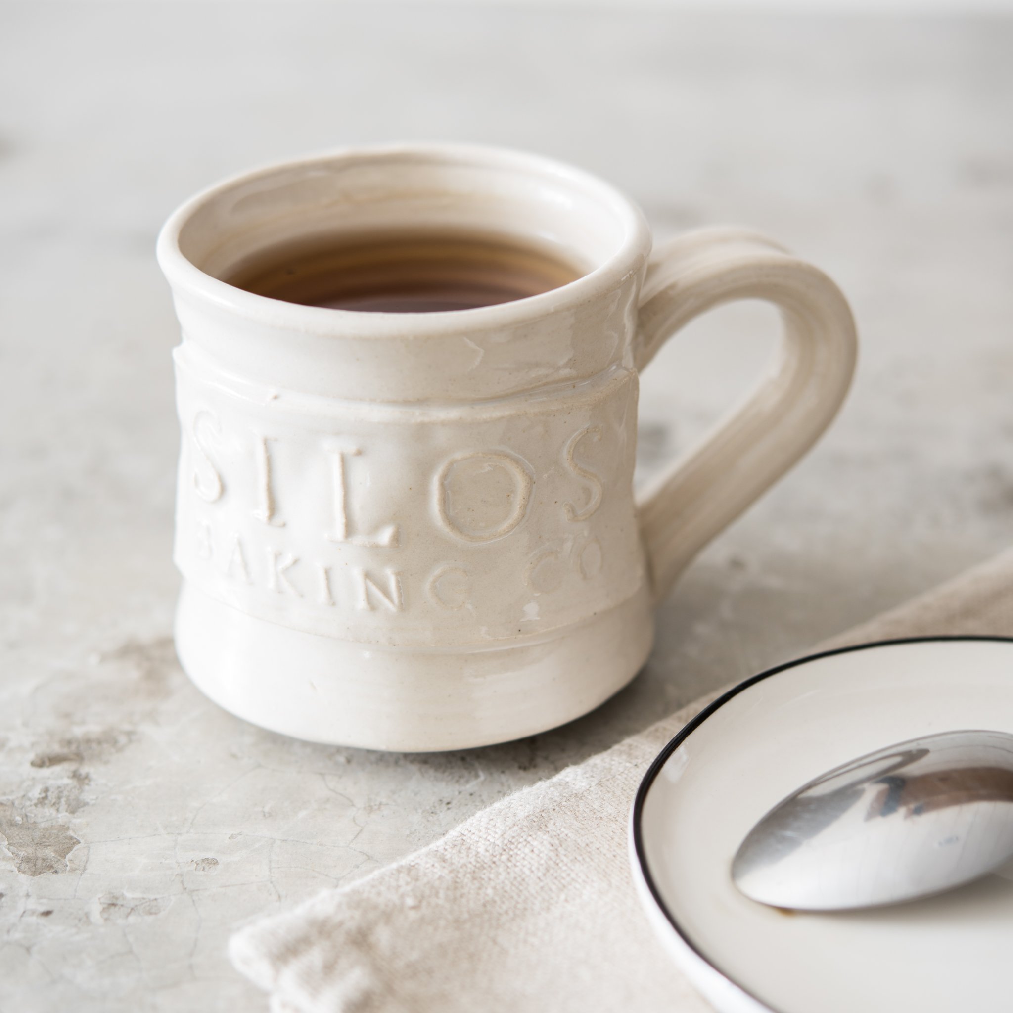 hand thrown coffee mug with silos baking co logo $24.00