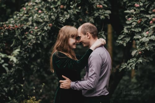 /_vercel/image?url=/Couple+smiling+to+each+other++with+the+apple+tree+in+background.&w=1536&q=100