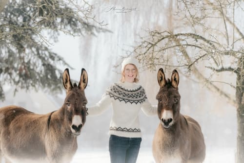 /_vercel/image?url=/Girl+with+two+donkeys+in+the+nature+with+snow.&w=1536&q=100