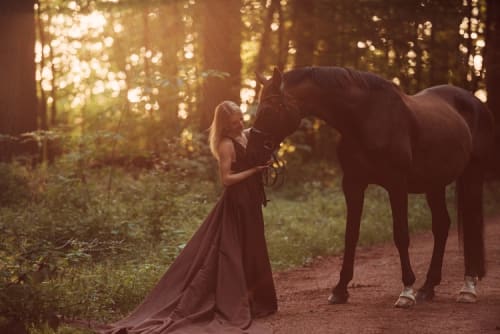 /_vercel/image?url=/Girl+in+long+dress+with+horse+in+the+forest.&w=1536&q=100