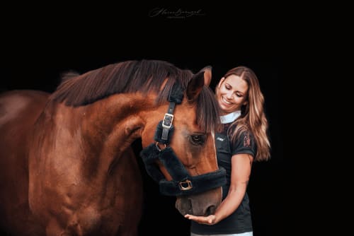 /_vercel/image?url=/Sport+horse+photography+on+the+black+background+with+rider.&w=1536&q=100