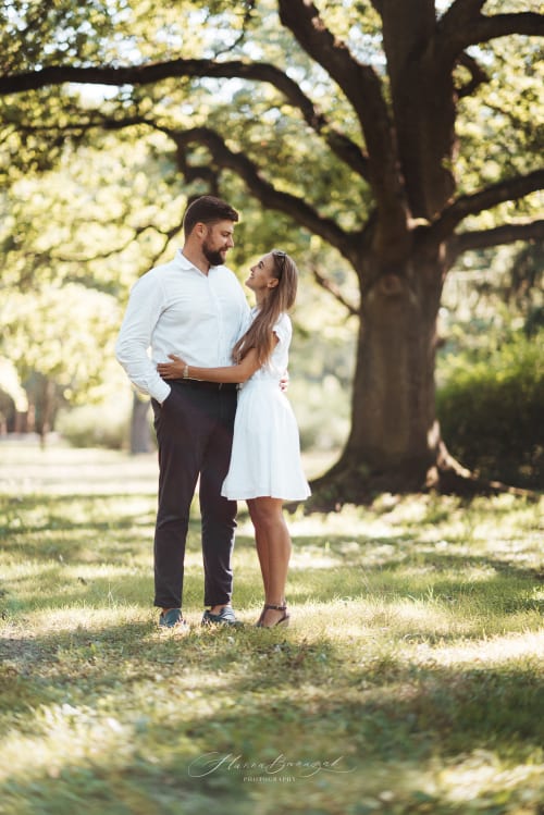 /_vercel/image?url=/Elegant+couple+standing+in+the+parc+and+looking+at+each+other+with+love.&w=1536&q=100