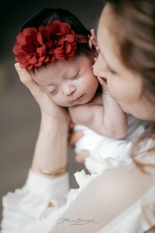 /_vercel/image?url=/Baby+kissed+by+her+Mom.&w=1536&q=100