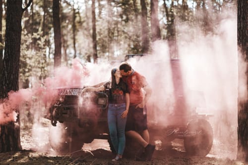 /_vercel/image?url=/Couple+is+sitting+on+the+4x4+car+in+the+smoke+in+the+forest.&w=1536&q=100