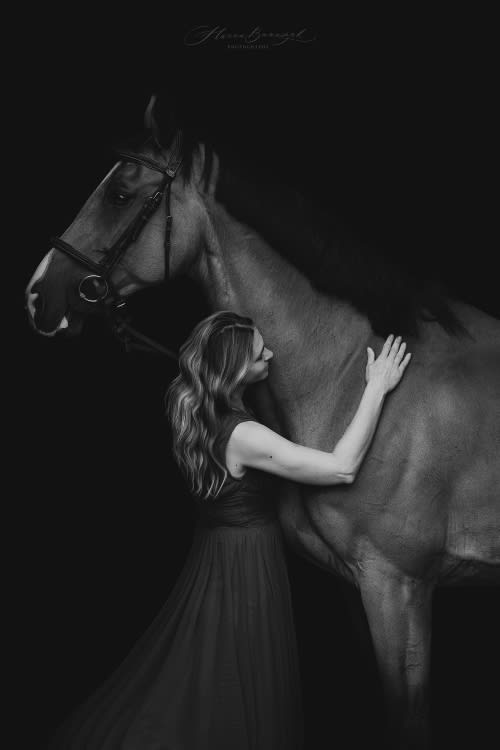 /_vercel/image?url=/Women+in+dress+with+horse+on+black+background.&w=1536&q=100