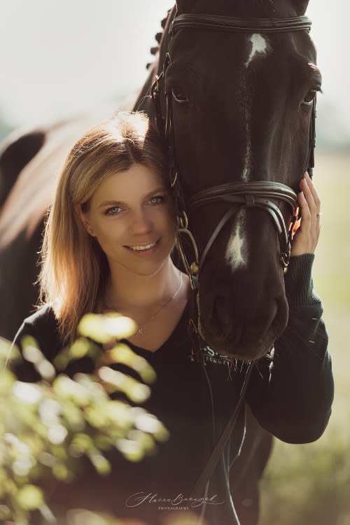 /_vercel/image?url=/Portrait+of+a+girl+with+her+horse+in+the+nature.&w=1536&q=100