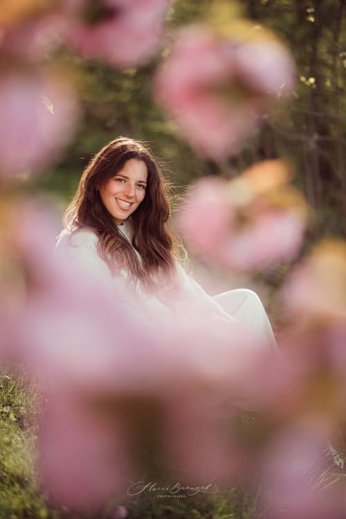 /_vercel/image?url=/Portrait+of+woman+with+blooming+tree.&w=1536&q=100