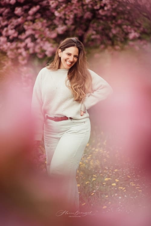 /_vercel/image?url=/Portrait+of+woman+with+flowers.&w=1536&q=100