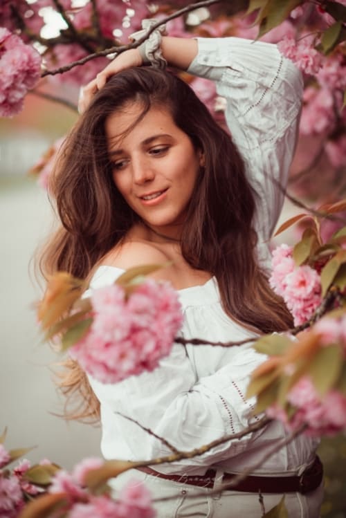 /_vercel/image?url=/Portrait+of+woman+next+to+cherries+tree.&w=1536&q=100