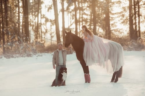 /_vercel/image?url=/Boy,+dog+and+girl+in+pink+dress+on+a+horse+in+the+nature+with+snow.&w=1536&q=100