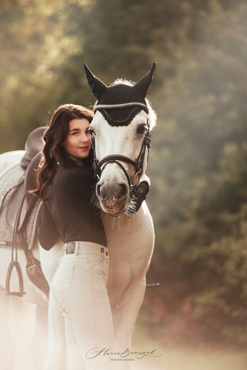 /_vercel/image?url=/Young+girl+hugs+white+horse+during+sunset,+the+are+standing+on+the+path.+&w=1536&q=100