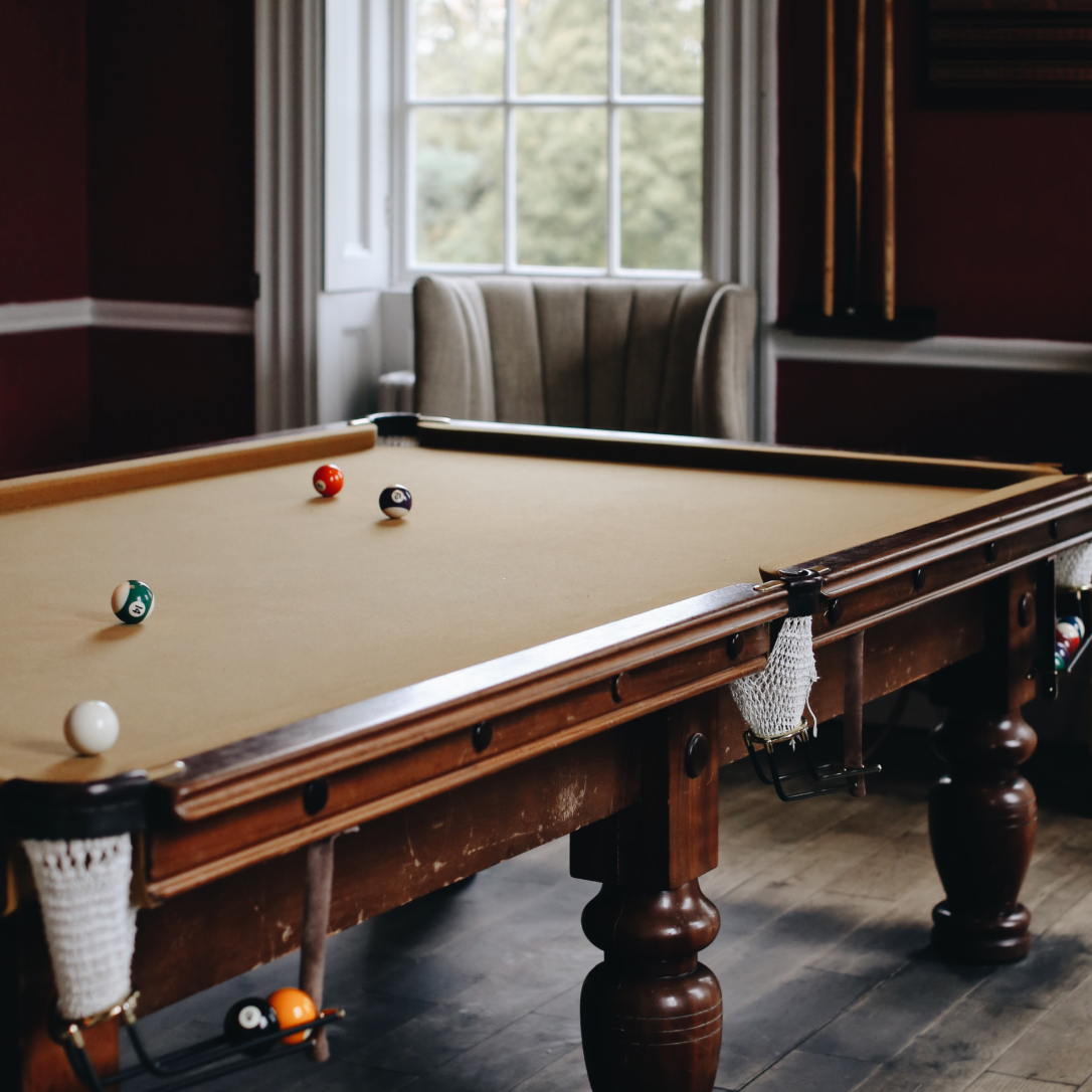 An interior space with a pool table.