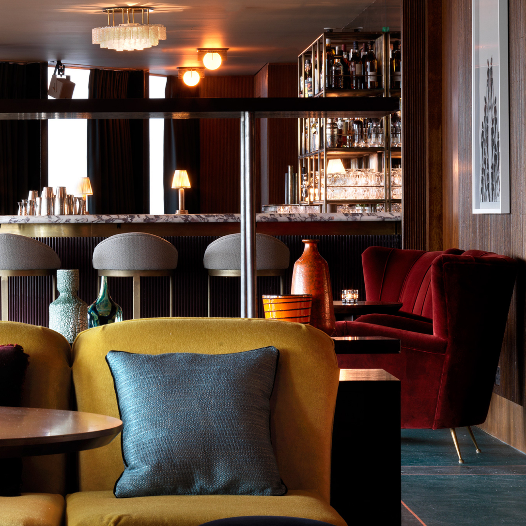 A lounge like space with a bar.